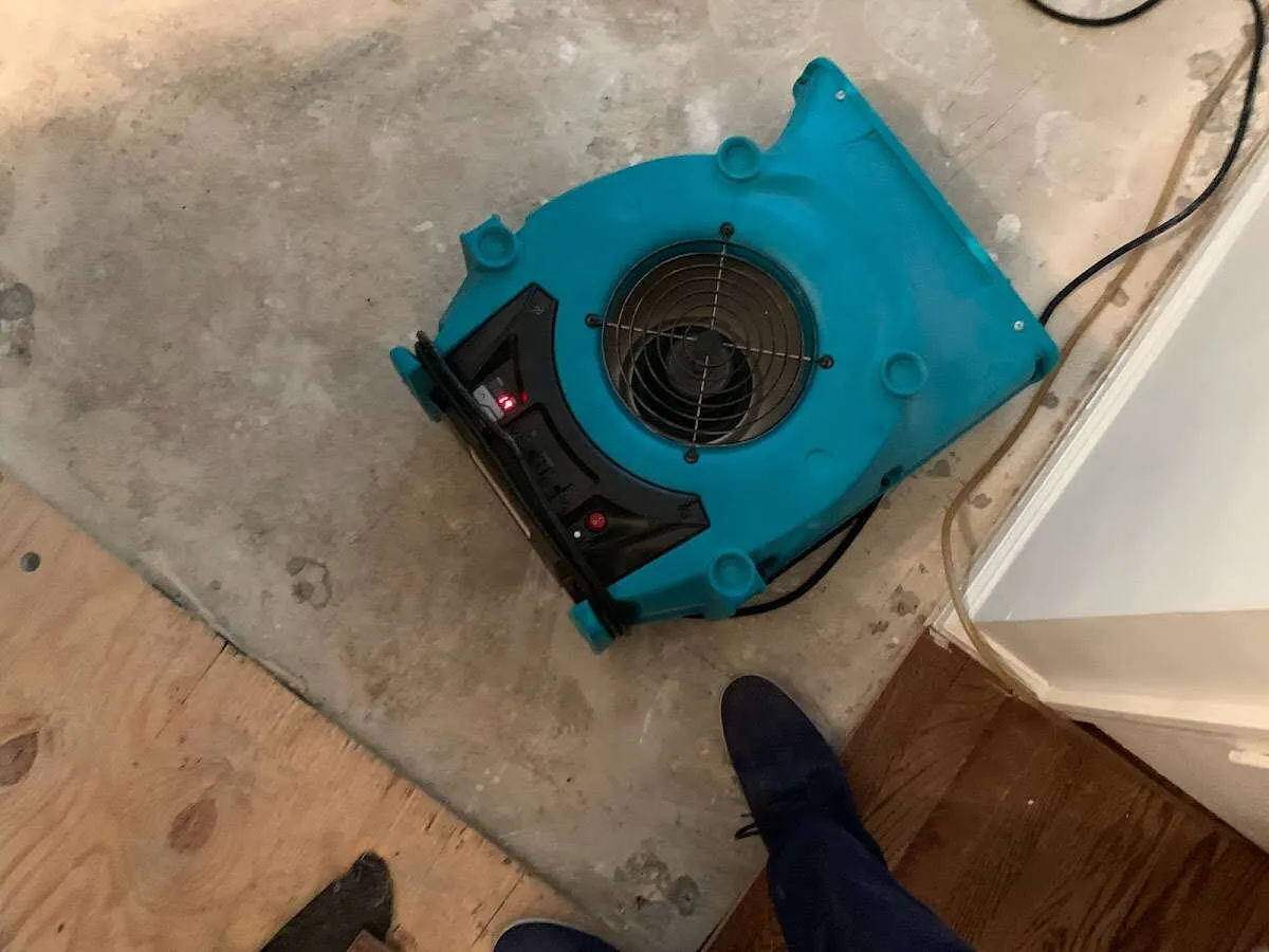 Air mover drying subfloor during Leak Detection & Repair in Austin